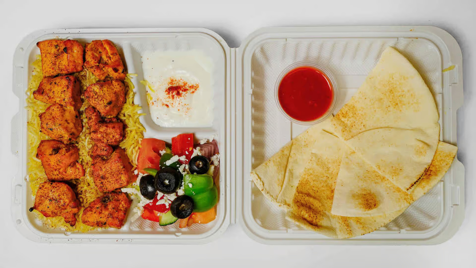 Chicken Kebab Plate - Grilled chicken kebab skewers with rice, grilled vegetables, and signature sauces