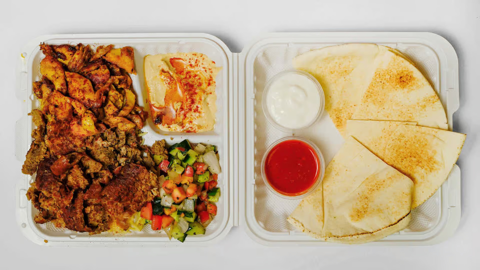 Mix Plate - A delicious combination of chicken and beef donair with rice, salad, and signature sauces